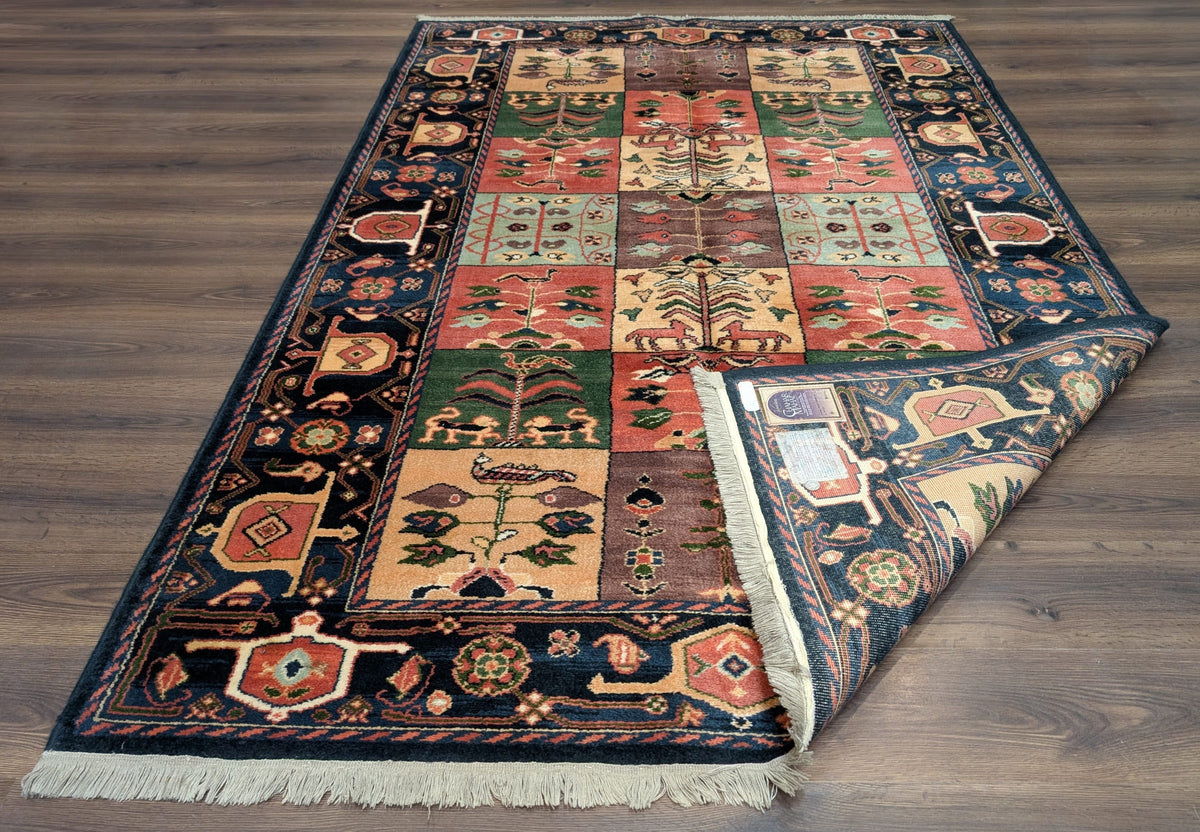 Karastan Rug 5' 9" x 8' 6", Chahar Mahal Village Garden 605, Wool USA 5' 9" x 8' 6" in Dark Blue, Blue, Ivory, Salmon Red, Yellow, Mauve and Multicolor - 2603L096